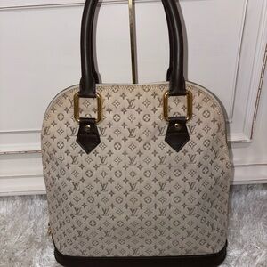 Louis Vuitton mini Lin Alma haut Handbag